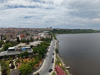 Obraz premium Panoramic Aerial Cityscape Under a Dramatic Cloudy Sky
