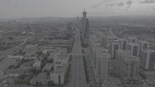 Aerial drone view of Baku city highway, cable-stayed bridge and urban skyline, Azerbaijan