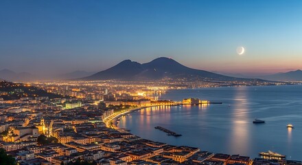 Fototapeta premium Illuminated Coastal City Overlooking Twin Volcanoes at Twilight