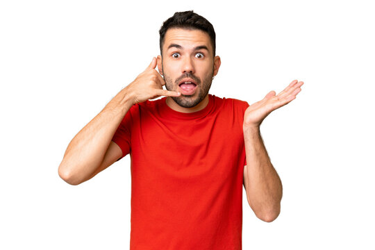 Young handsome caucasian man over isolated chroma key background making phone gesture and doubting