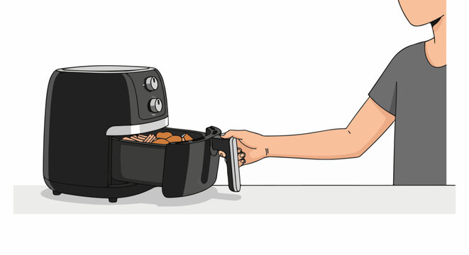 Hand holding basket of food from an air fryer