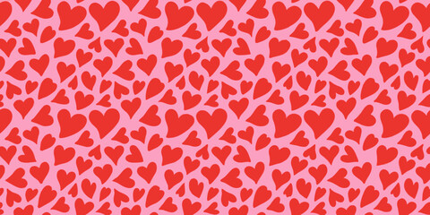 Red hearts seamless pattern on pink background repeating romantic design © Dibyendu