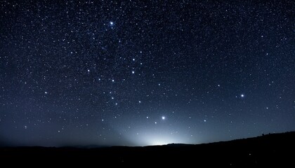 Fototapeta premium Dark Night Sky Speckled With Stars