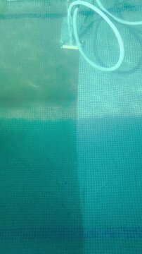 Cleaning Swimming Pool Floor During Summer Pool Maintenance in 4K