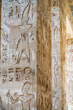 Close up details of the reliefs and hieroglyphs inside Medinat Habu, the ancient Egyptian Mortuary Temple of Ramesses III on the West Bank of The Nile, Luxor, Egypt.