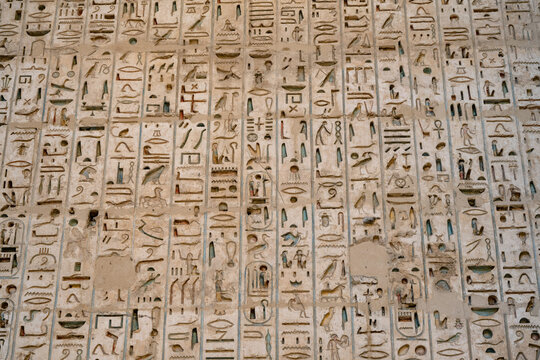 Close up details of the reliefs and hieroglyphs inside Medinat Habu, the ancient Egyptian Mortuary Temple of Ramesses III on the West Bank of The Nile, Luxor, Egypt.