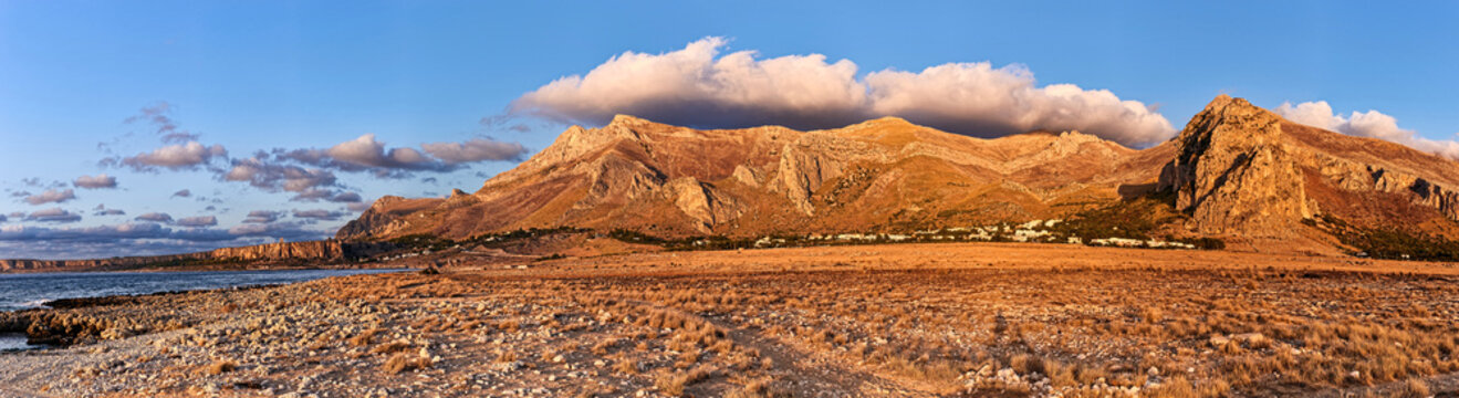 Stunning sunset panorama of a rugged Mediterranean landscape and cliffs in Sicily near San Vito Lo Capo