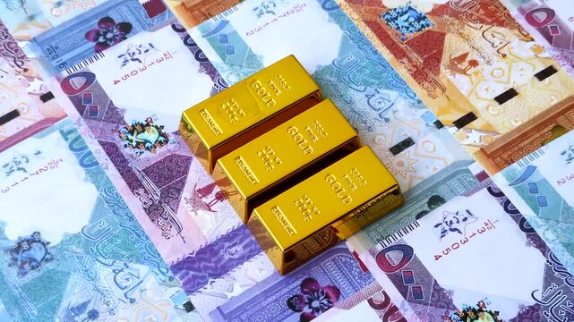 Qatari gold bars or ingots as a tool for balance, financial investment, and savings. Qatari gold bars as a financial backdrop for your design