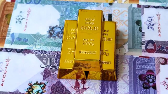 Qatari gold bars or ingots as a tool for balance, financial investment, and savings. Qatari gold bars as a financial backdrop for your design