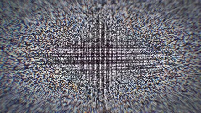 Vintage TV static with timestamp overlay, retro broadcast interference effect