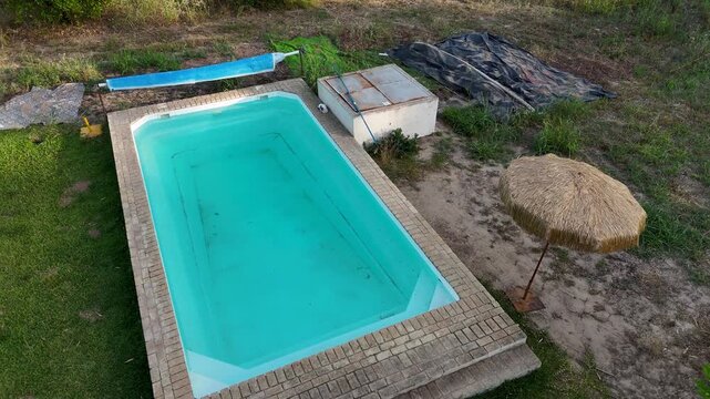Drone aerial view of a dirty swimming pool