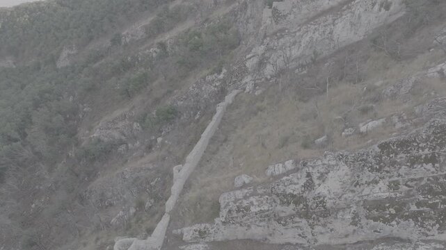 Aerial drone view of ancient fortress walls built on rocky mountain cliffs, Azerbaijan Drone, historical heritage
