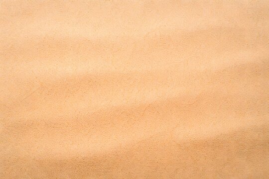 High resolution macro detail of soft light orange suede leather surface showing a natural organic texture with subtle grain and elegant warm tones for background design
