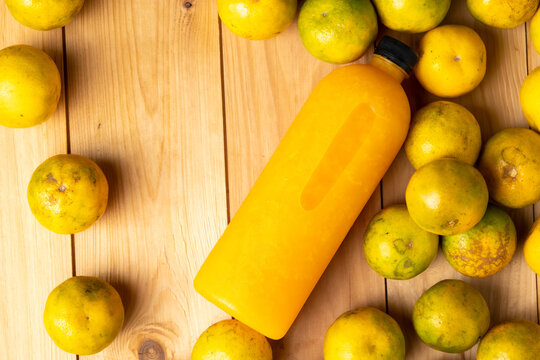 Background and banner, Orange juice pattern, Bottles of tasty juice with oranges and wood background