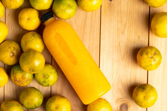 Background and banner, Orange juice pattern, Bottles of tasty juice with oranges and wood background