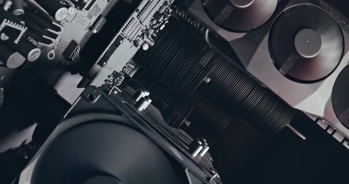 Camera move along components. Working motherboards, graphic cards and fans.