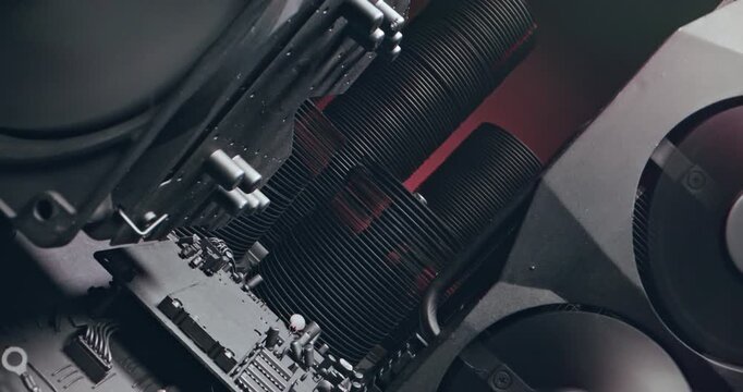 Working motherboards, fans and graphic cards. Camera move along components.