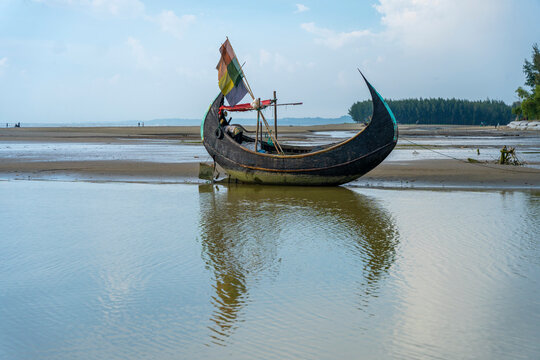 Traditional wooden fishing boat on the beautiful Inani Sea Beach in Ukhia Upazila of Cox&rsquo;s Bazar District, Bangladesh.