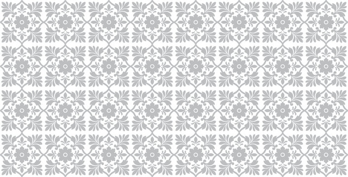Elegant seamless vector pattern featuring repeating floral elements and leafy scrolls in gray and white soft design.