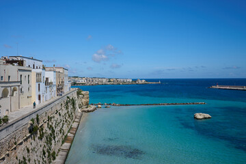 Fototapeta premium 17 May 2026 - Otranto, Italy - View of Otranto harbour / harbor and buildings overlooking sea under blue sky