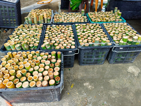 Fresh bamboo containers arranged for the preparation of lemang at a stall on the outskirts of Kuala Lumpur.