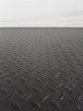 Black non-slip rubber flooring. Black rubber underlay to protect the surface and prevent slipping.