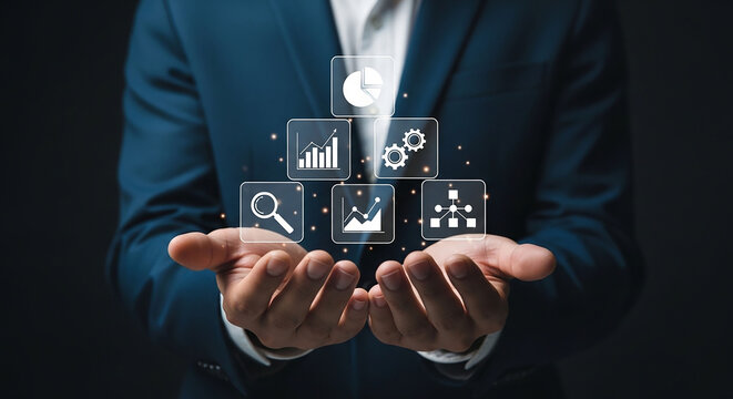 Business Data Visualization: A businessman in a blue suit presents a pyramid of digital infographics, showcasing business analytics and data visualization on a dark background.