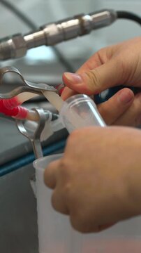Connecting Tubes And Managing Flow. Operators Connect Tubing And Gather Samples Near Pumps Safely . Stock clip