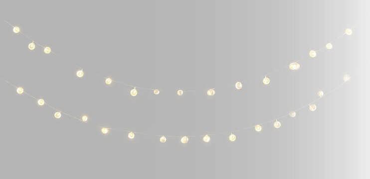 String lights set on grey background, yellow Christmas glowing garlands