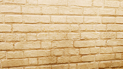 Fototapeta premium Light beige brick wall texture background, decorative masonry surface with rustic pattern suitable for construction and design projects.