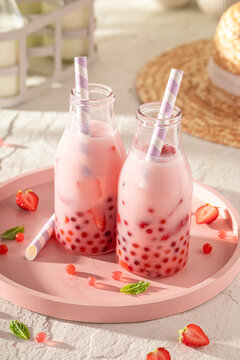 Fresh and cold strawberry bubble tea with berries and milk.