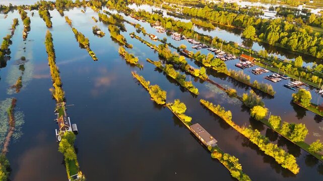 Aerial drone view the harbour of Scheendijk Loosdrechtse Plassen, a floating village in the Netherlands at sunset. High quality 4k footage