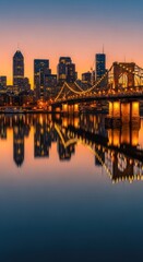 Fototapeta premium Vibrant Cityscape at Dusk with Illuminated Bridge and Reflection.
