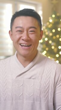 Joyful festive scene, Laughter and warmth radiate from man amid Christmas decorations and cheerful ambiance