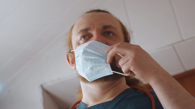 Medical worker checks safety protocol and personal protective equipment. Healthcare professional ensures safety measures and equipment are properly arranged before visiting patient