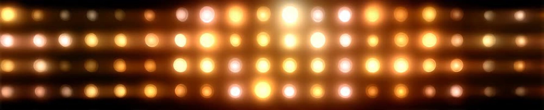 Wall of flashing round incandescent light bulbs on black background. Retro stage lighting grid video background, banner.	
