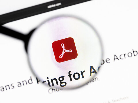 Milan, Italy 2026, 20 Apr Closeup of Adobe Acrobat website on a laptop screen. Adobe Acrobat logo under a magnifying glass.