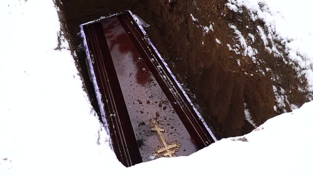 Military Funeral Ceremony with Ukrainian Flag Draped Coffin and Red Roses