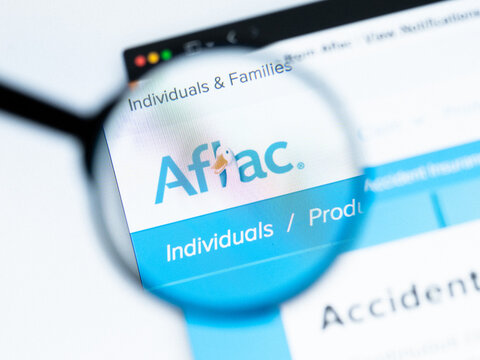 Milan, Italy 2026, 20 Apr Closeup of Aflac website on a laptop screen. Aflac logo under a magnifying glass.