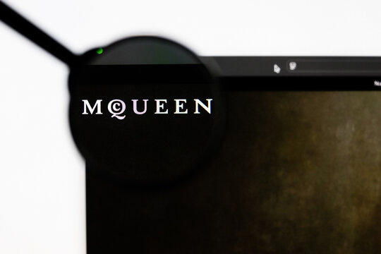 Milan, Italy 2026, 20 Apr Closeup of Alexander McQueen website on a laptop screen. Alexander McQueen logo under a magnifying glass.