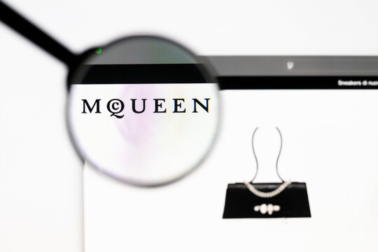 Milan, Italy 2026, 20 Apr Closeup of Alexander McQueen website on a laptop screen. Alexander McQueen logo under a magnifying glass.