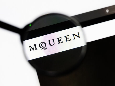Milan, Italy 2026, 20 Apr Closeup of Alexander McQueen website on a laptop screen. Alexander McQueen logo under a magnifying glass.