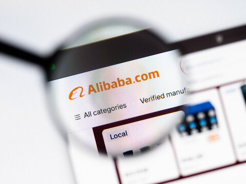 Milan, Italy 2026, 20 Apr Closeup of Alibaba website on a laptop screen. Alibaba logo under a magnifying glass.