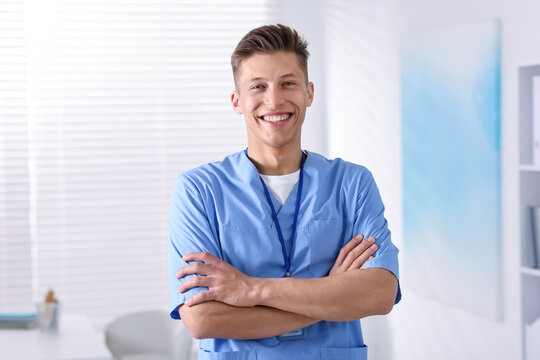 Portrait of medical assistant with badge in clinic