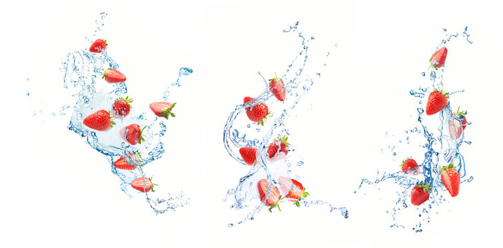 Fresh strawberries and water splashes in air on white background, set