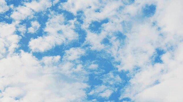 fluffy clouds in blue sky