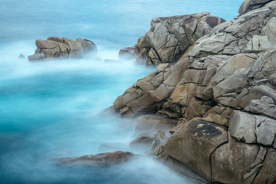Granite rock formations in the Cliffs of Paper in San Ciprian, Lugo, Galicia, Spain.