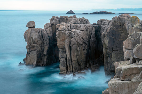Granite rock formations in the Cliffs of Paper in San Ciprian, Lugo, Galicia, Spain.