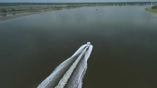 Drone shot of boat on water going fast