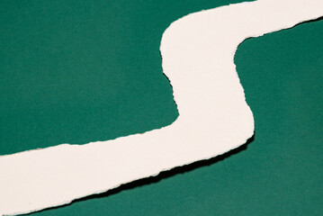 Torn White Paper Path on Deep Green Abstract Background. © sandor